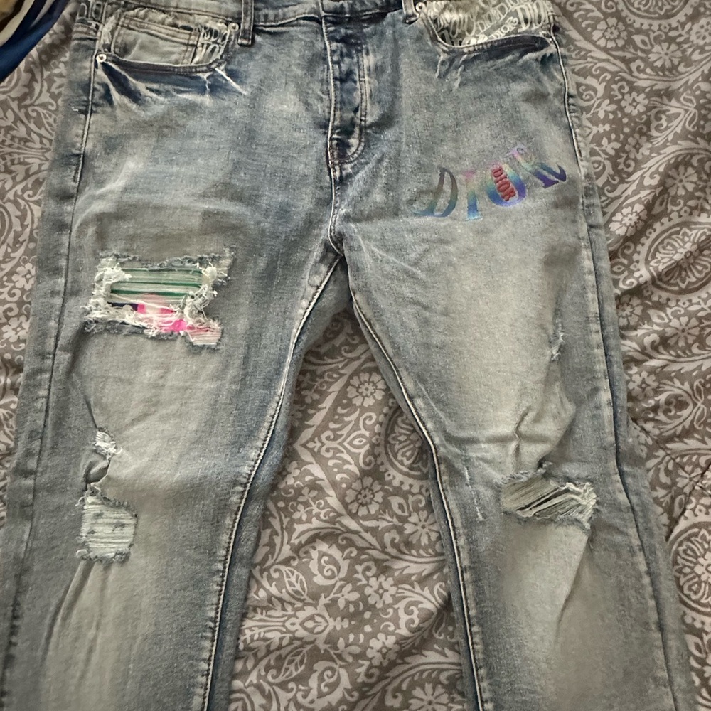 DIOR JEANS Distressed Light Blue Jeans with Colorful Patch